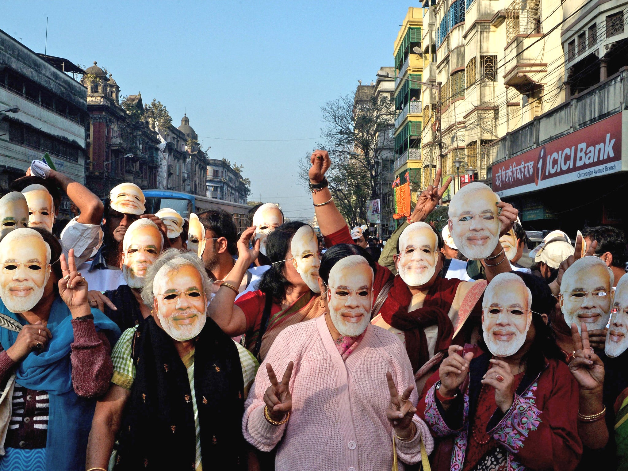 Narendra Modi's supporters participate in a rally in Kolkata