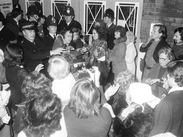 Police and protesters at PIE's first open meeting in London in 1977