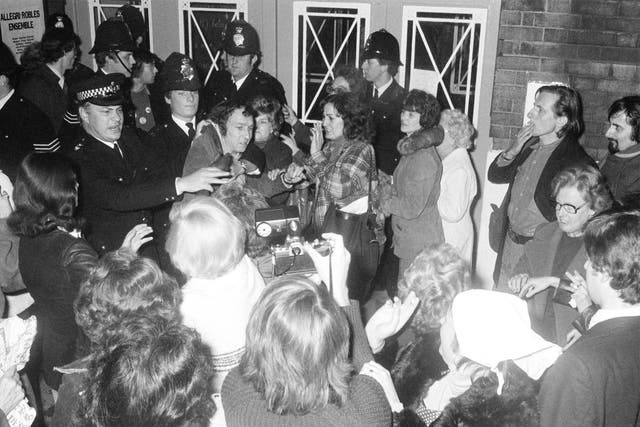 Police and protesters at PIE's first open meeting in London in 1977