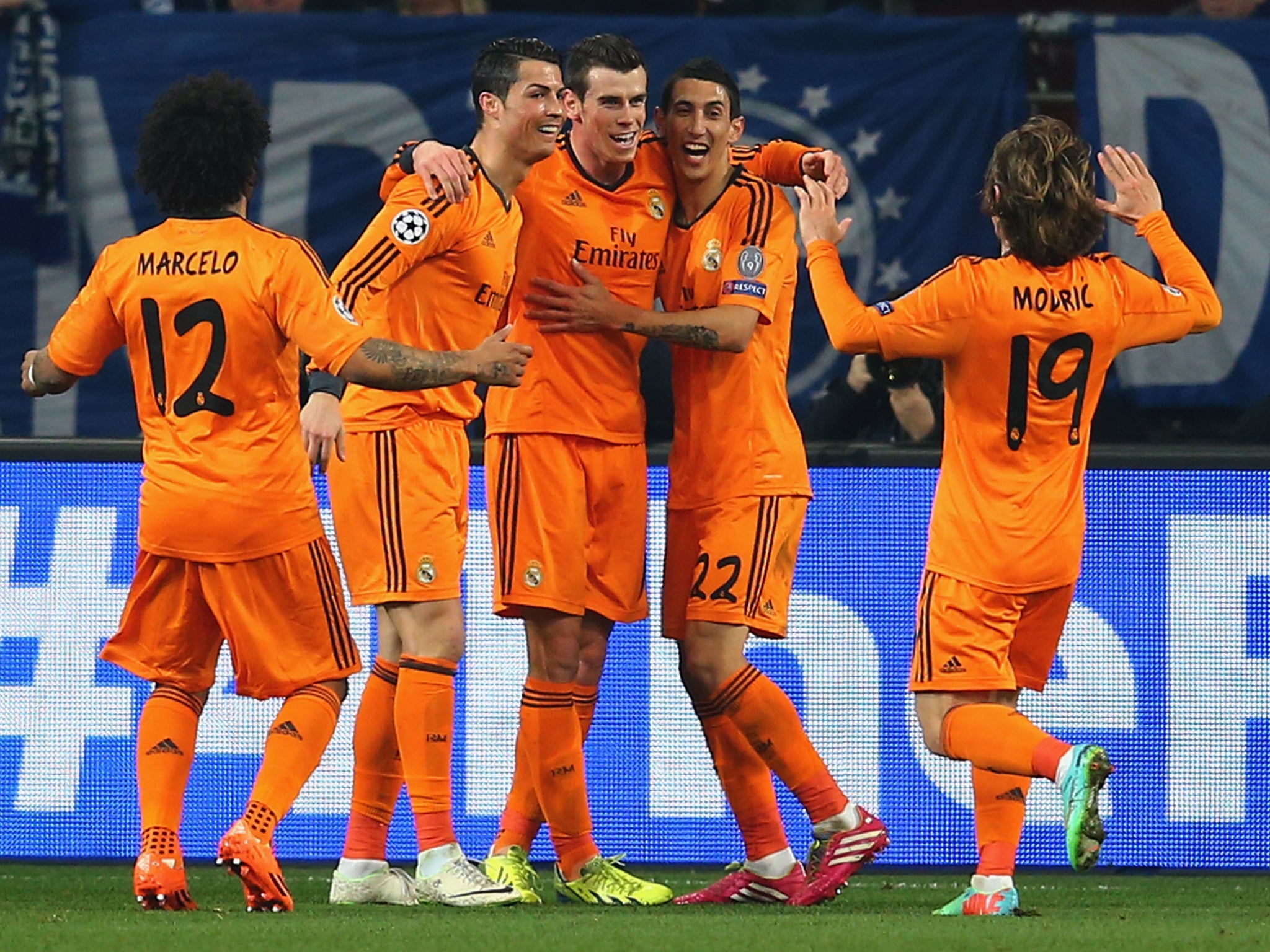 Gareth Bale celebrates with Cristiano Ronaldo and Angel Di Maria after scoring in the 6-1 rout of Schalke