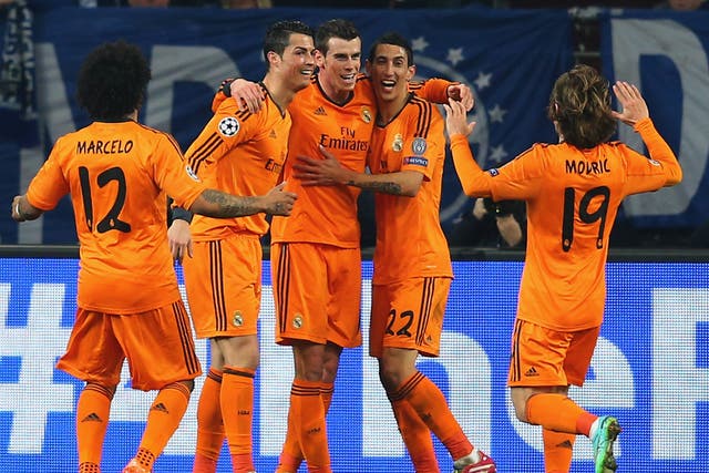 Gareth Bale celebrates with Cristiano Ronaldo and Angel Di Maria after scoring in the 6-1 rout of Schalke three weeks ago