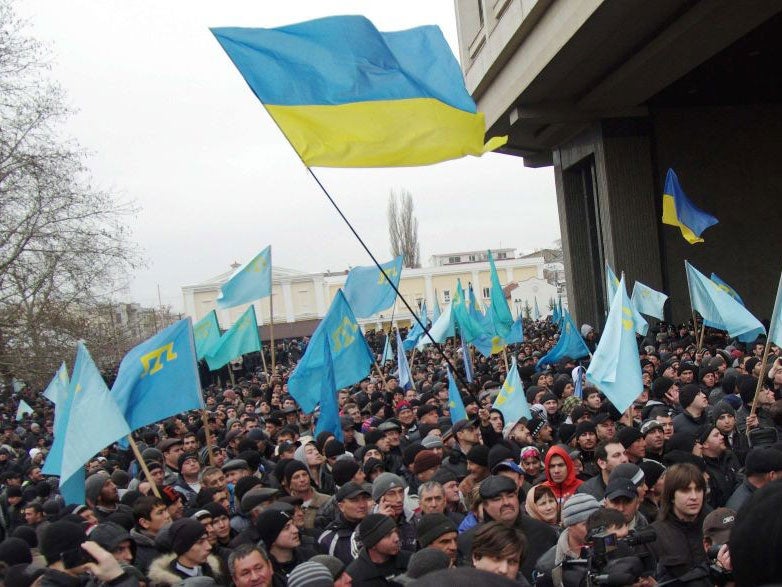 Pro-Ukrainian activists rally in front of the Crimean parliament in Semfiropol yesterday