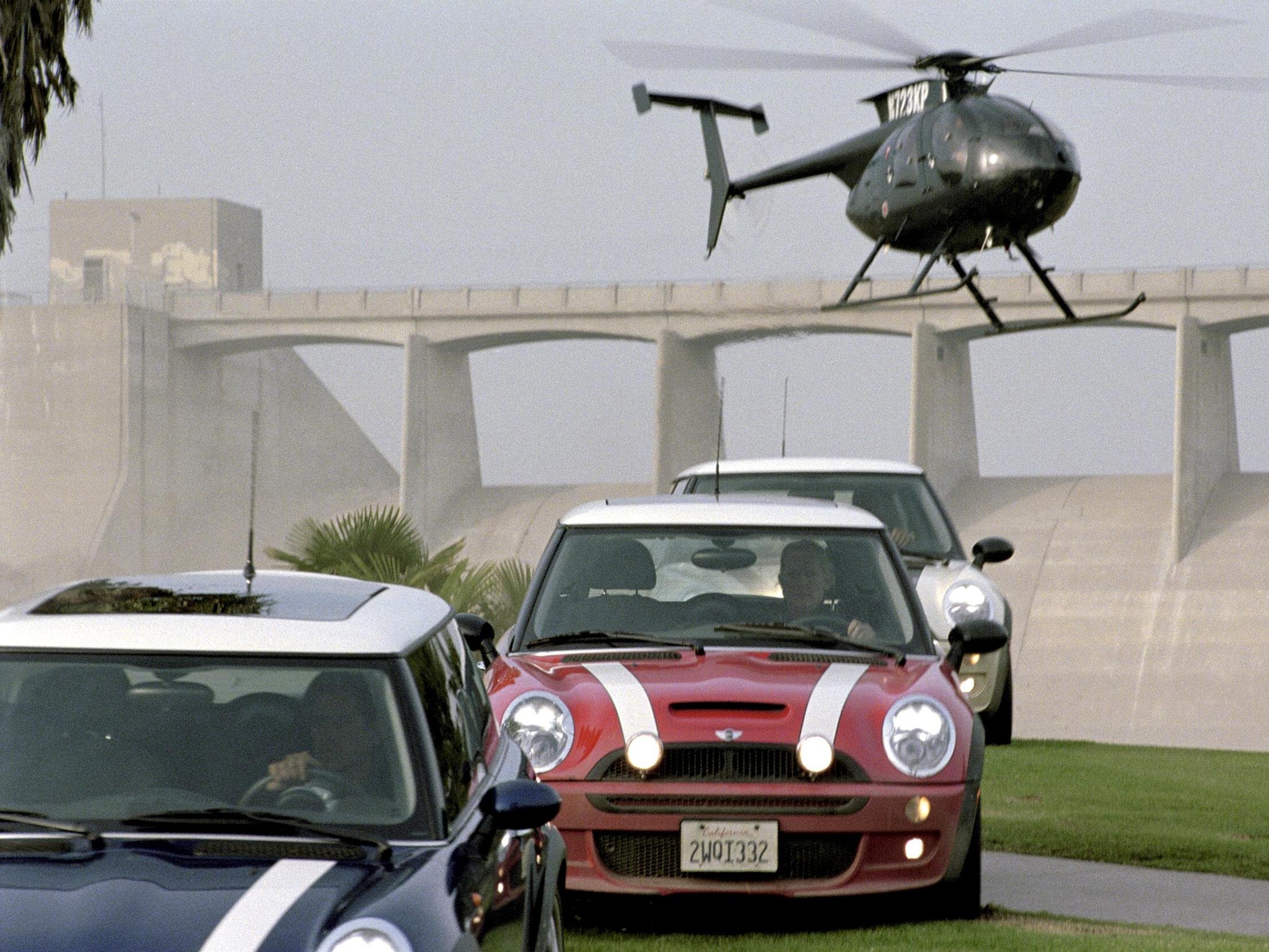 The quartet used Mini Coopers to make their getaway like the film 'The Italian Job' (pictured)