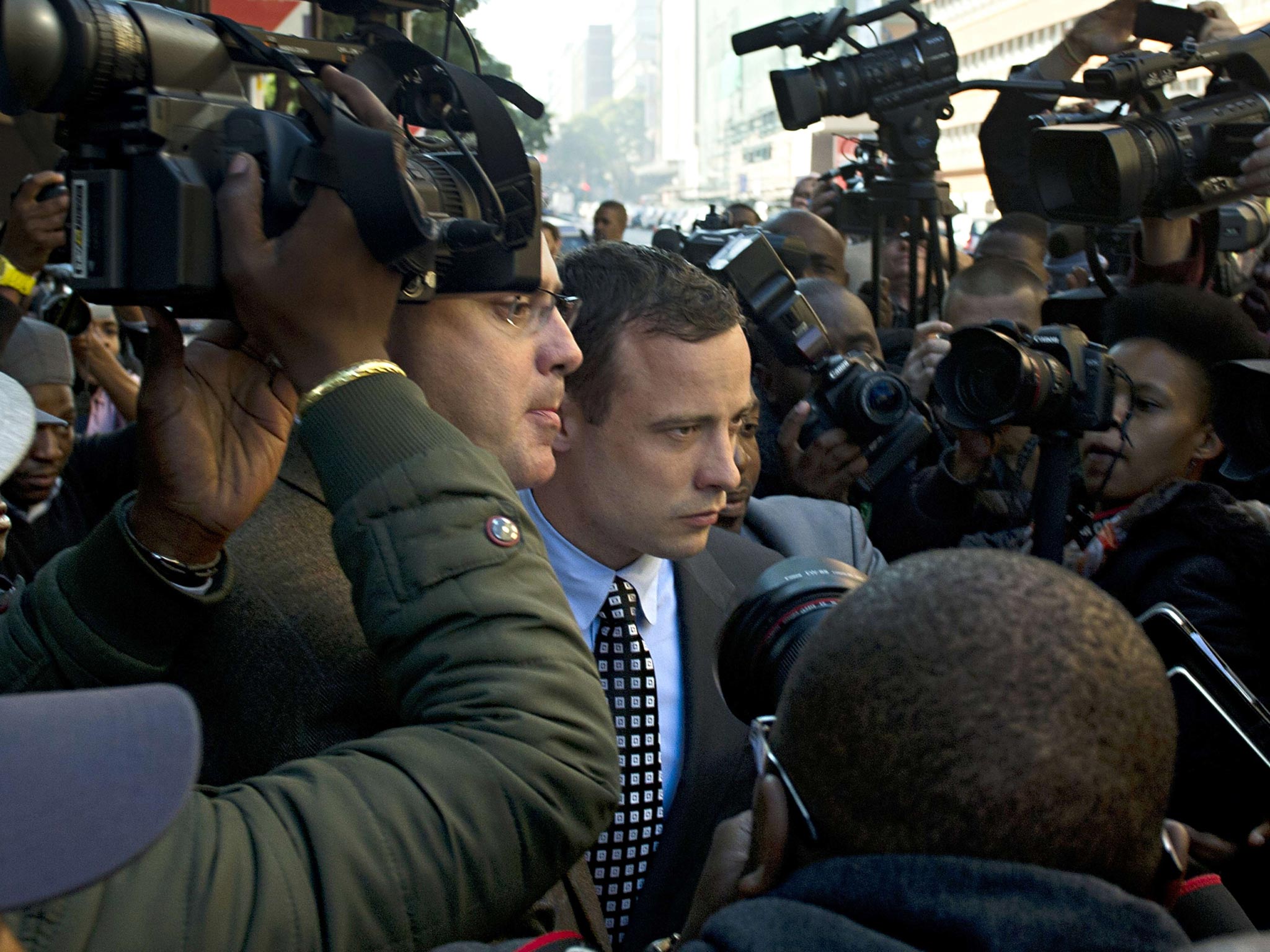 Oscar Pistorius leaving court last year