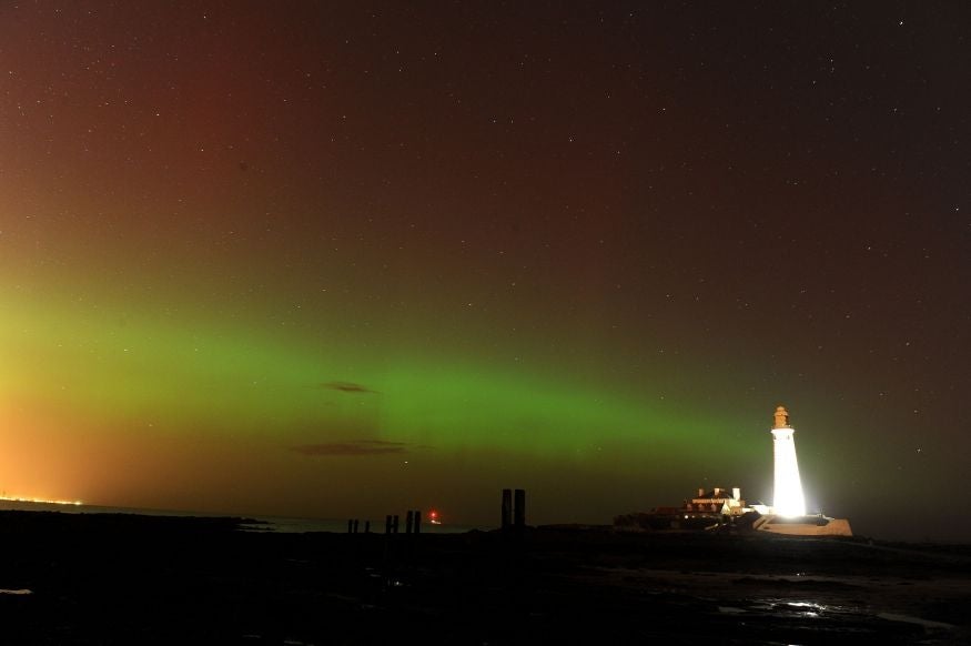The aurora borealis at St. Mary's Lighthouse and Visitor Centre, Whitley Bay, North Tyneside.