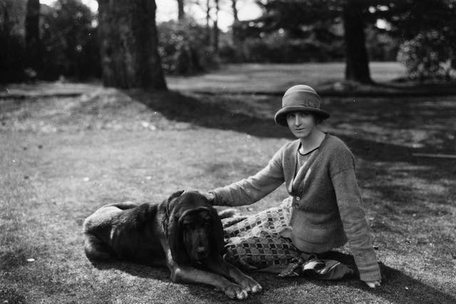 English novelist Rose Macaulay with her bloodhound