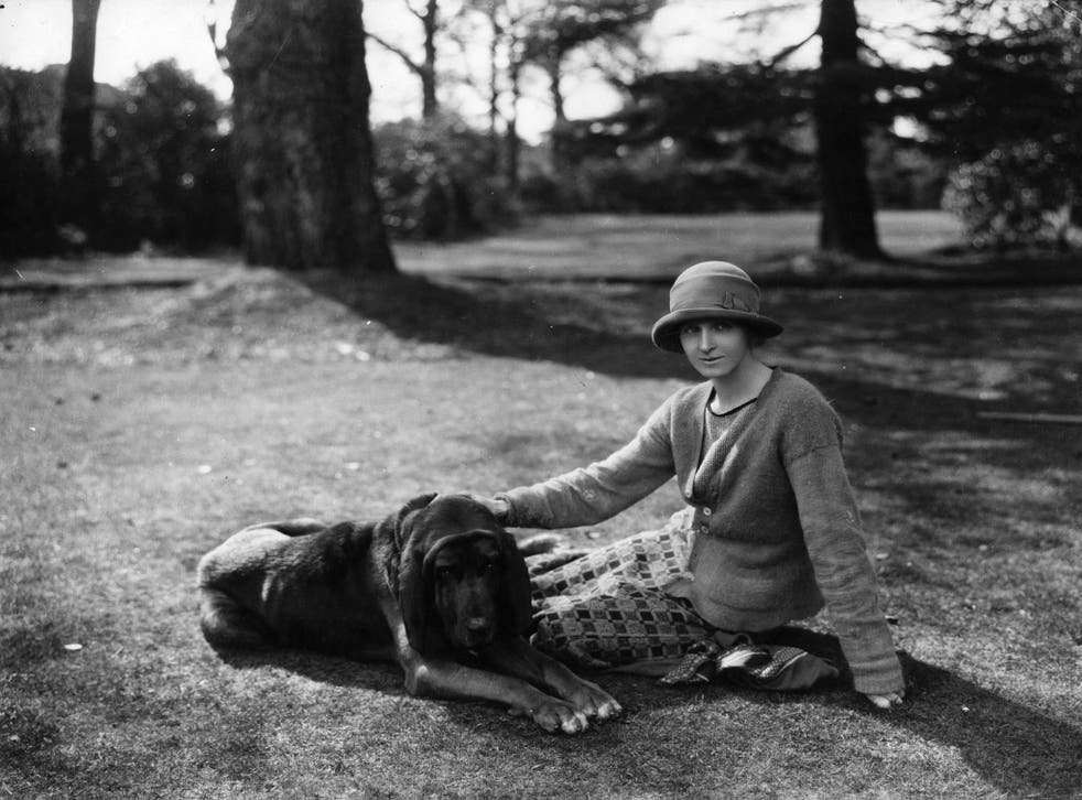 English novelist Rose Macaulay with her bloodhound