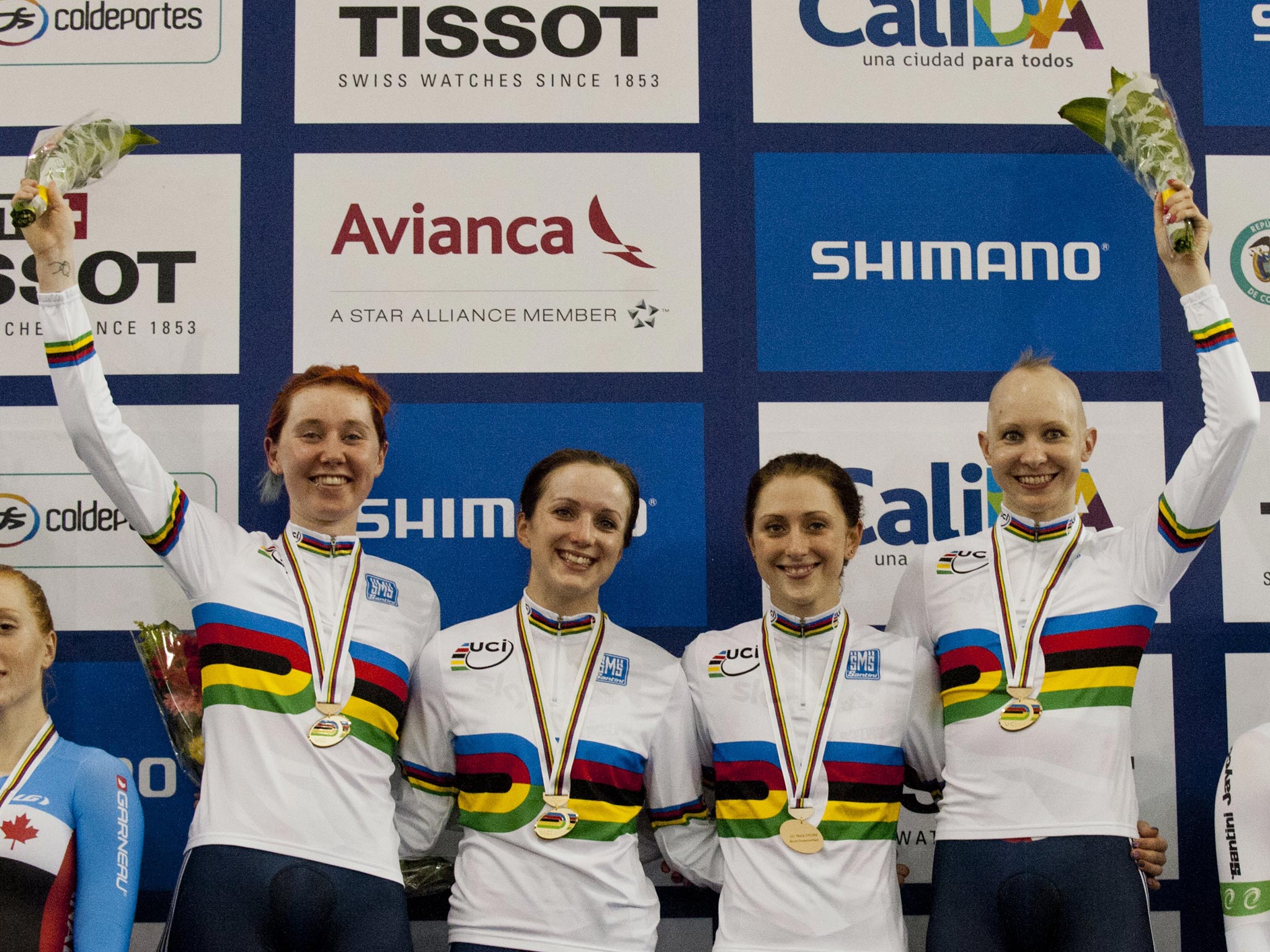 Great Britain team Katie Archibald (2-L), Elinor Barker (1-L), Laura Trott (1-R) and Joanna Rowsell pose on the winners podium after winning gold medals in the Women's Team Persuit Final