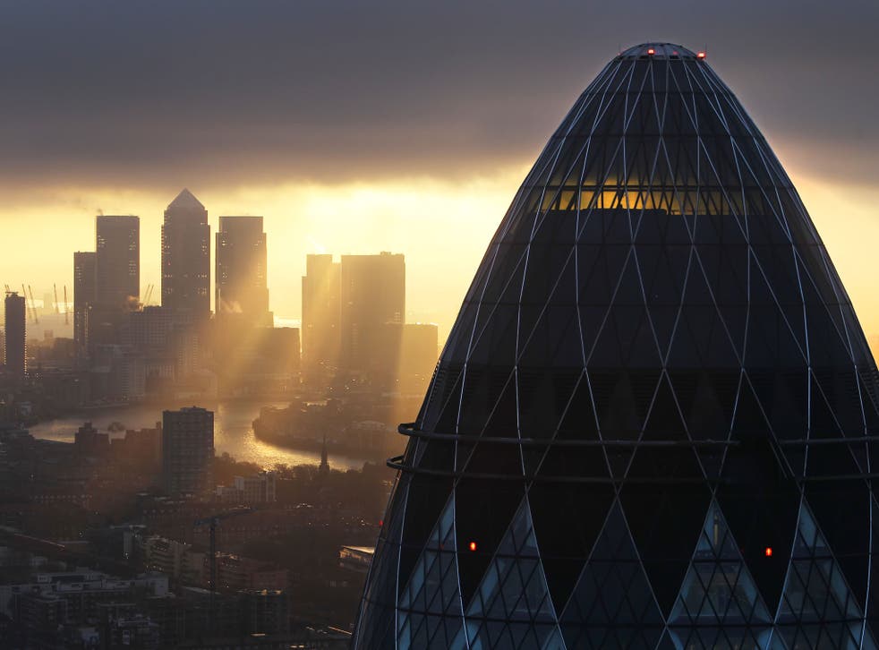 Sun rises over the City of London on February 25, 2010 in London