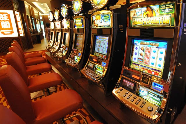 <p>File: A row of slot machines await gamblers at the opening of Singapore's first casino, the Resorts World Sentosa complex, in Singapore </p>