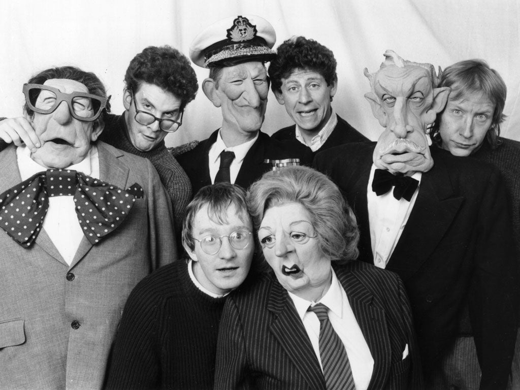 1st February 1985: Four of the voice artists on the satirical TV programme, 'Spitting Image' with some of the puppets, for which they provide voices (Margaret Thatcher, Robin Day, Vincent Price and Prince Philip). Back, left to right: Chris Barrie, Jon Gl