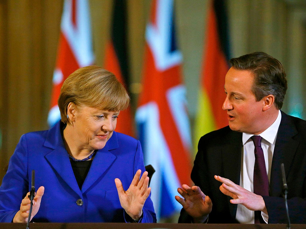 German Chancellor Angela Merkel (L) and Britain's Prime Minister David Cameron address a news conference at 10 Downing Street in London, on February 27, 2014. Angela Merkel urged Britain Thursday to stay in the EU but played down David Cameron's hopes that her visit to London would bring major reforms.