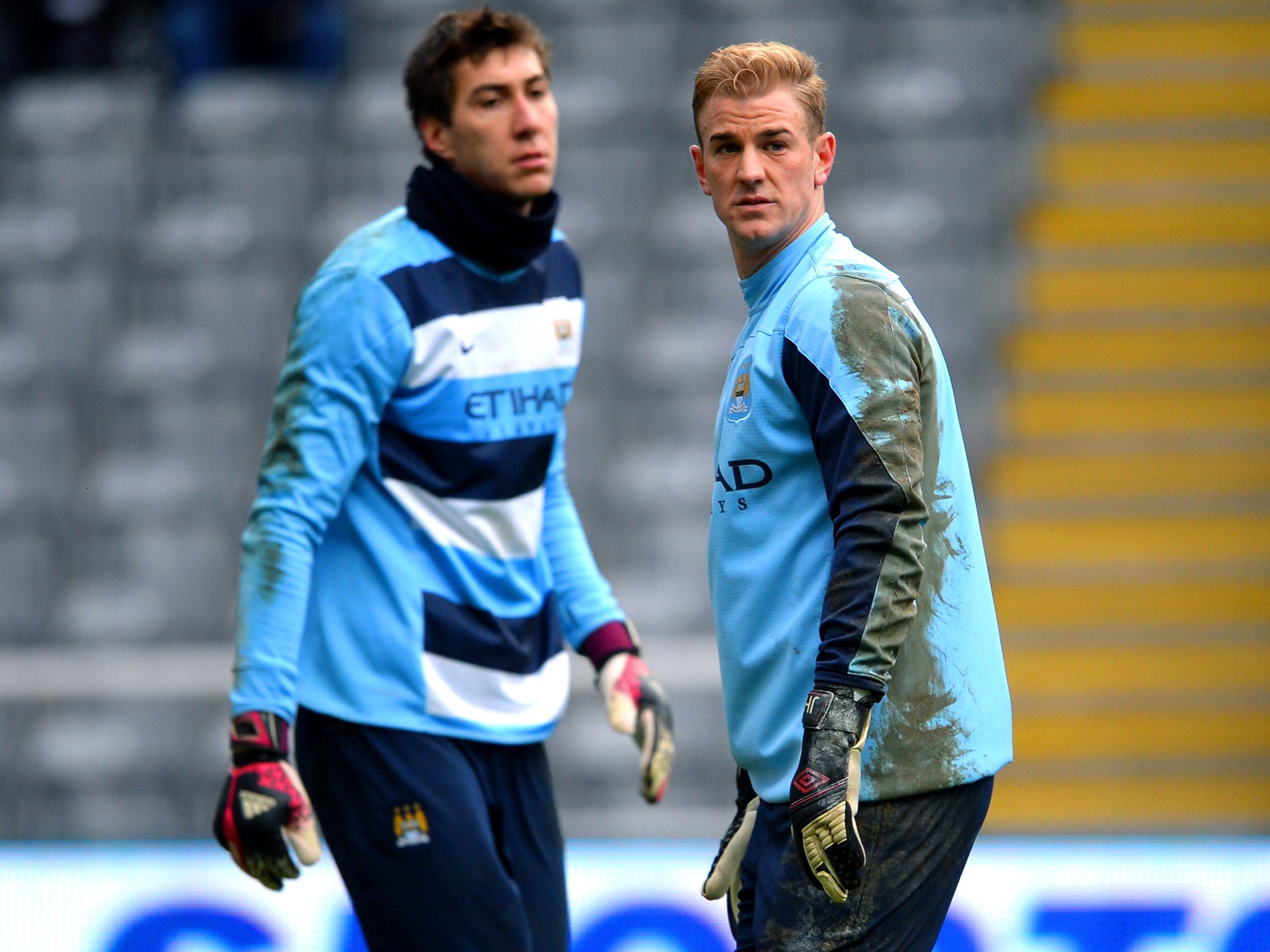 Costel Pantilimon and Joe Hart (right) are vying to play in goal for
Manchester City tomorrow