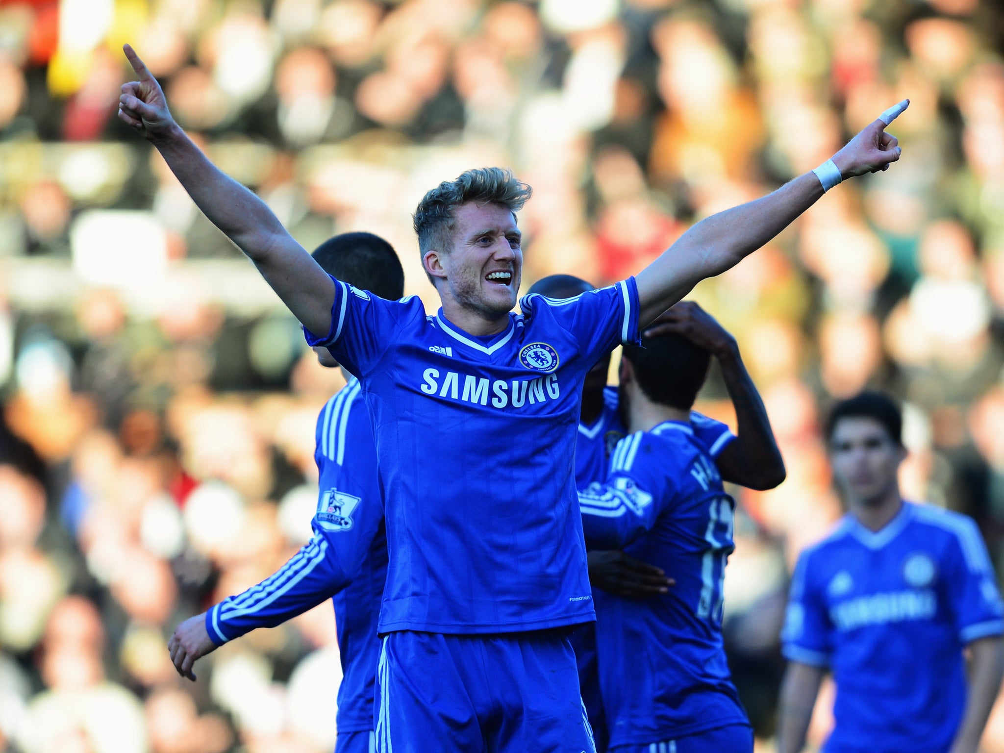Andre Schurrle celebrates scoring his third goal for Chelsea in their victory over Fulham