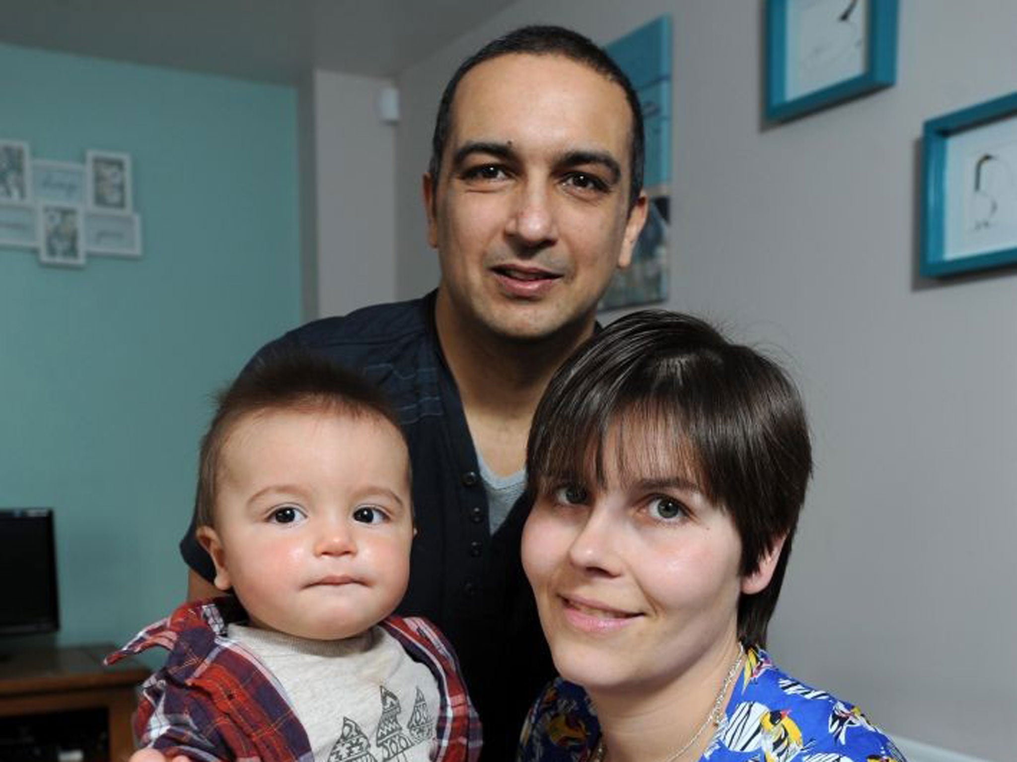 Marie Walker, 33, and her partner, Brian Serajuddy, 39, with their eight-month-old son Harry