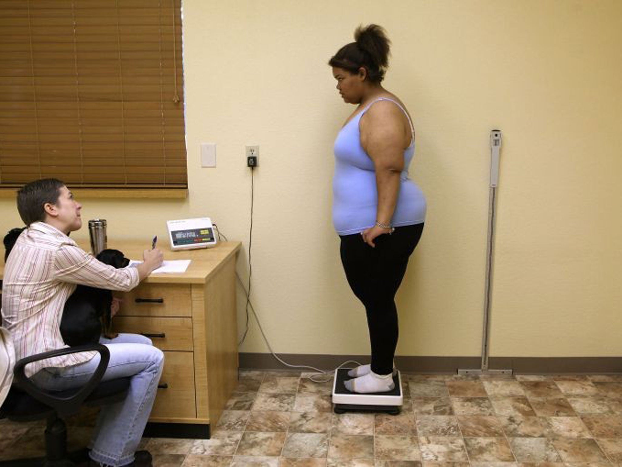 Heavy task: A 17-year-old US student gets to grips with her weight