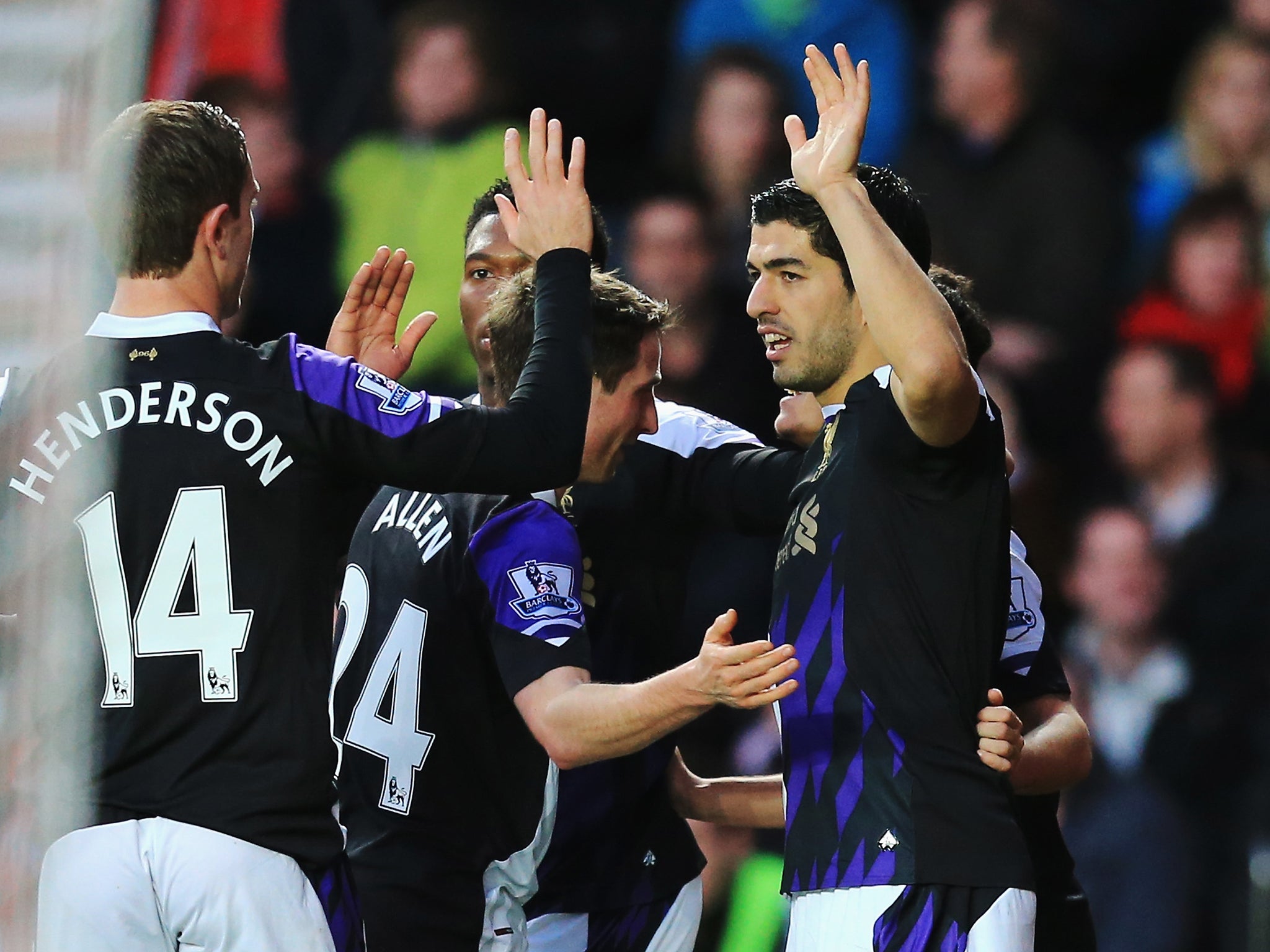 Luis Suarez celebrates his goal with his Liverpool team-mates during the 3-0 victory over Southampton