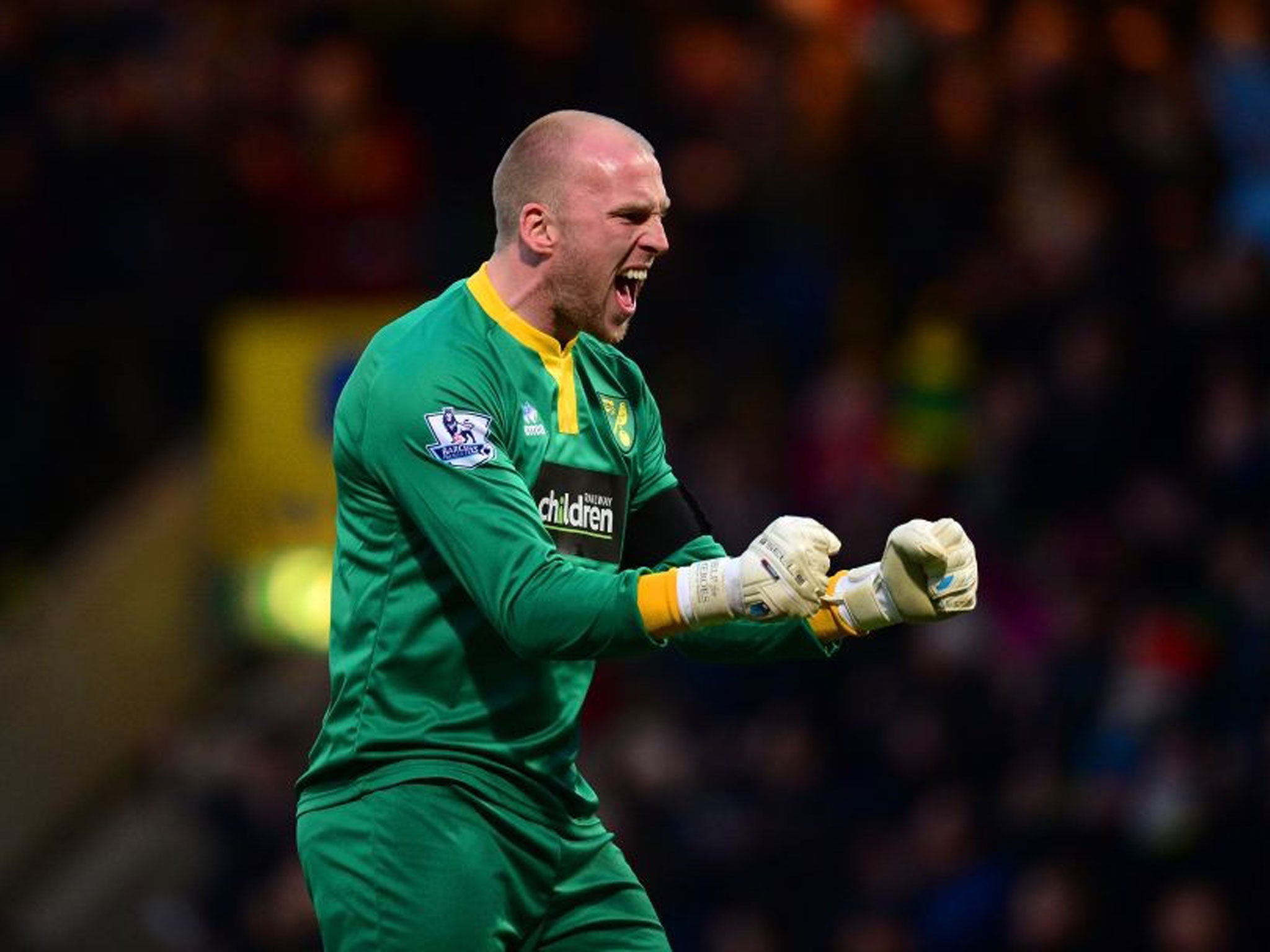 Raise the bar: John Ruddy has taken the place of his England rival Fraser Forster at Norwich and reckons he plays at a higher level