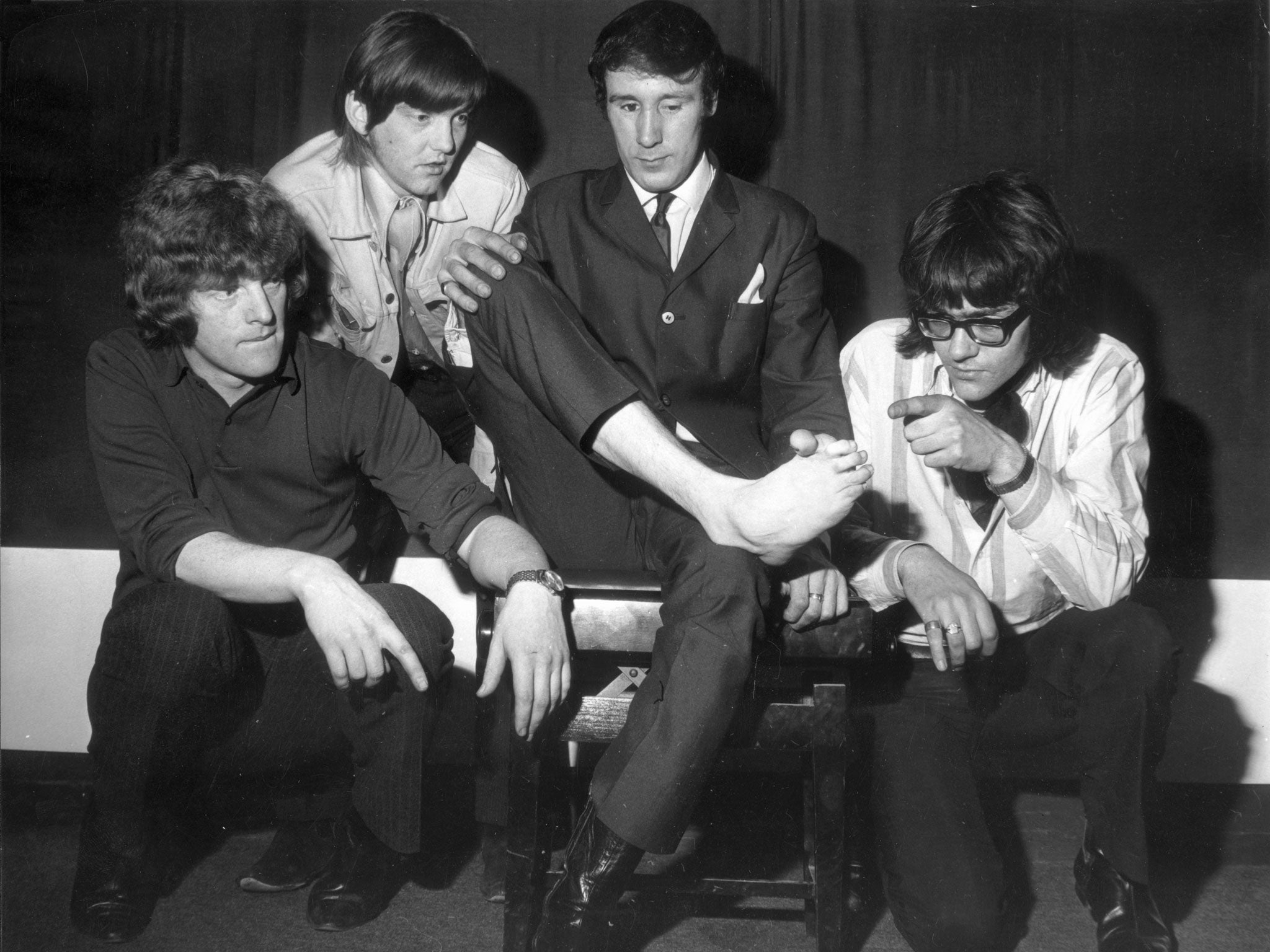 Lee's band in 1968, including Ian Hunter, far left, inspect the foot with which Lee played the piano