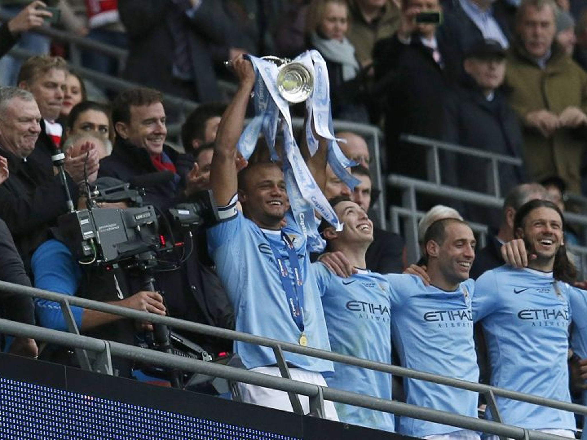 Manchester City captain Vincent Kompany holds aloft the trophy after defeating Sunderland to win the English League Cup final match at Wembley Stadium (Reuters)