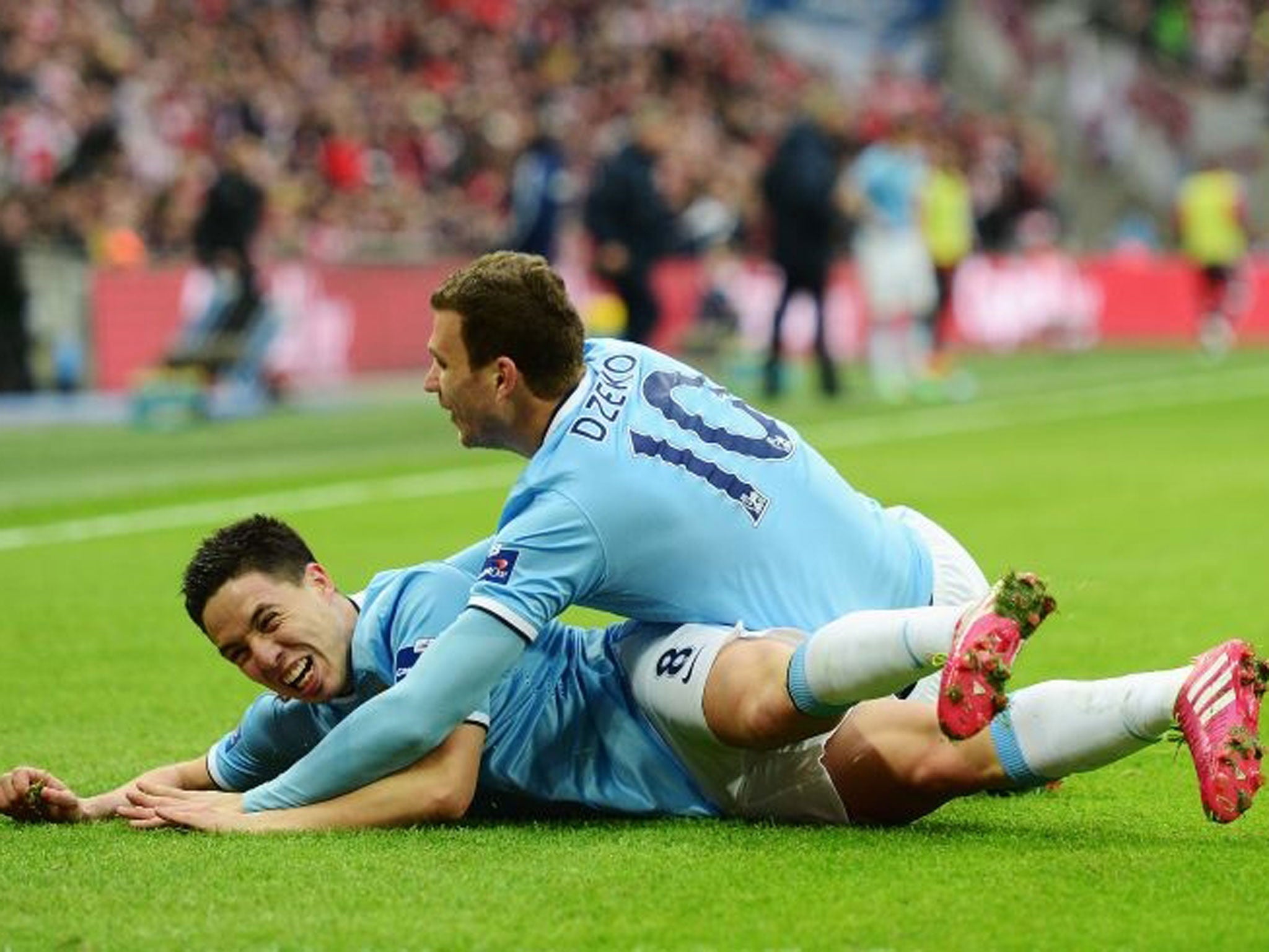Samir Nasri of Manchester City celebrates his goal with Edin Dzeko (R) during the Capital One Cup Final between Manchester City and Sunderland at Wembley Stadium (Getty)