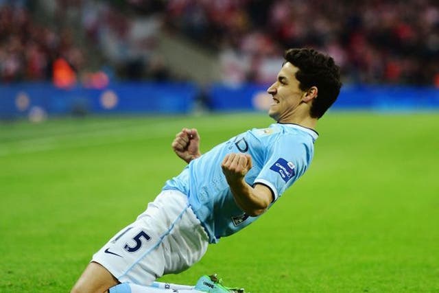 Jesus Navas of Manchester City celebrates after scoring his team's third goal during the Capital One Cup Final between Manchester City and Sunderland at Wembley Stadium (Getty)