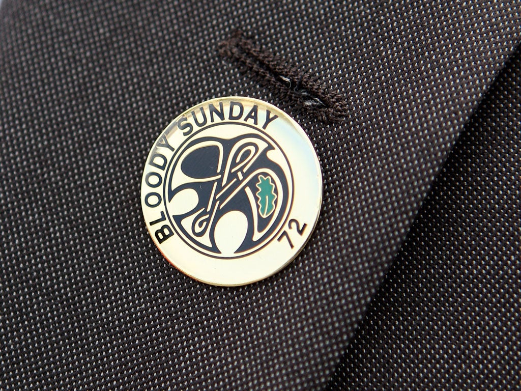 Danny McGowan, a relative of Bloody Sunday victim Daniel McGowan, wears a Bloody Sunday pin badge as he prepares to march from the Bogside area of Londonderry to the Guildhall to gain a preview of the Saville Report on June 15, 2010 in Londonderry, Northern Ireland.