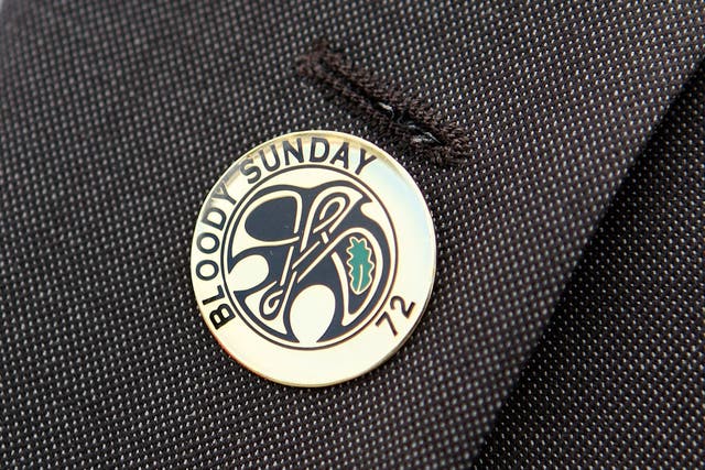 Danny McGowan, a relative of Bloody Sunday victim Daniel McGowan, wears a Bloody Sunday pin badge as he prepares to march from the Bogside area of Londonderry to the Guildhall to gain a preview of the Saville Report on June 15, 2010 in Londonderry, Northern Ireland.