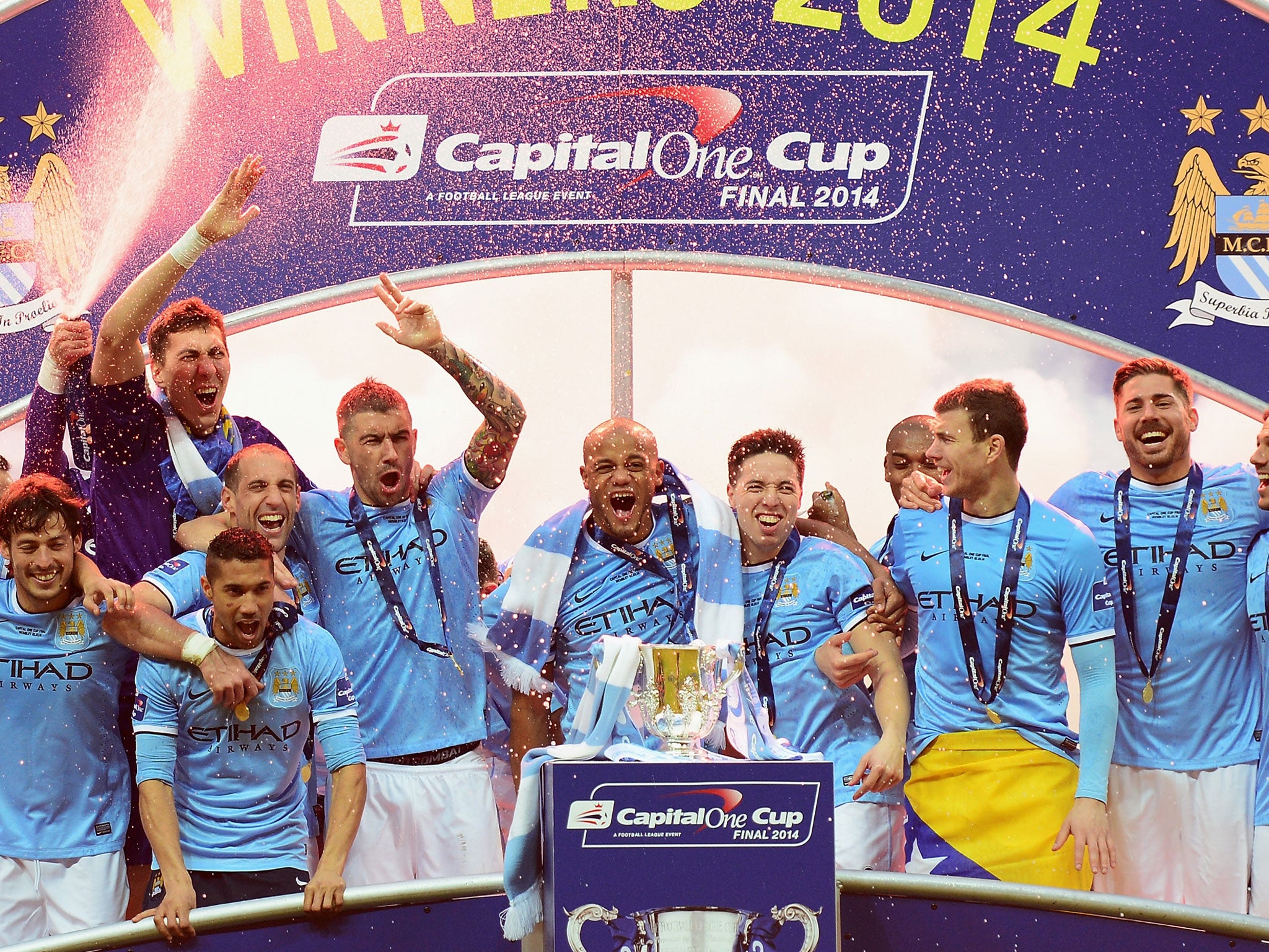The Manchester City squad celebrate their Capital One Cup triumph