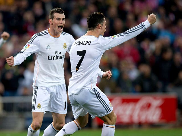 Gareth Bale (left) celebrates with Cristiano Ronaldo after the Portuguese forward equalised