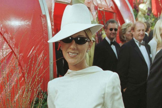 Canadian singer Celine Dion made a bold fashion statement at the 71st Academy Awards, deciding to wear her white Christian Dior tuxedo backwards with a matching fedora and diamond-encrusted sunglasses.