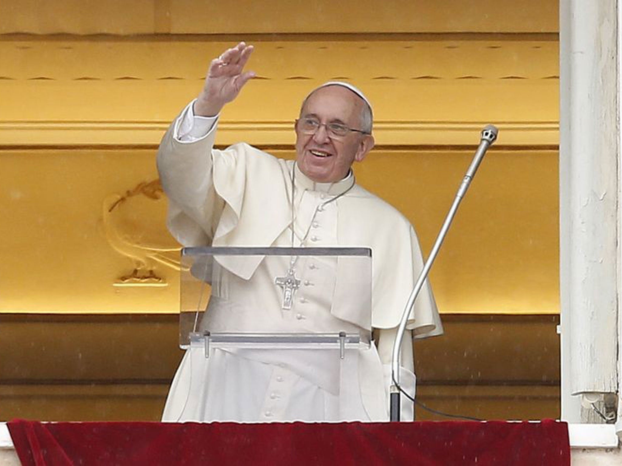 Pope Francis greets the crowd during his Sunday address