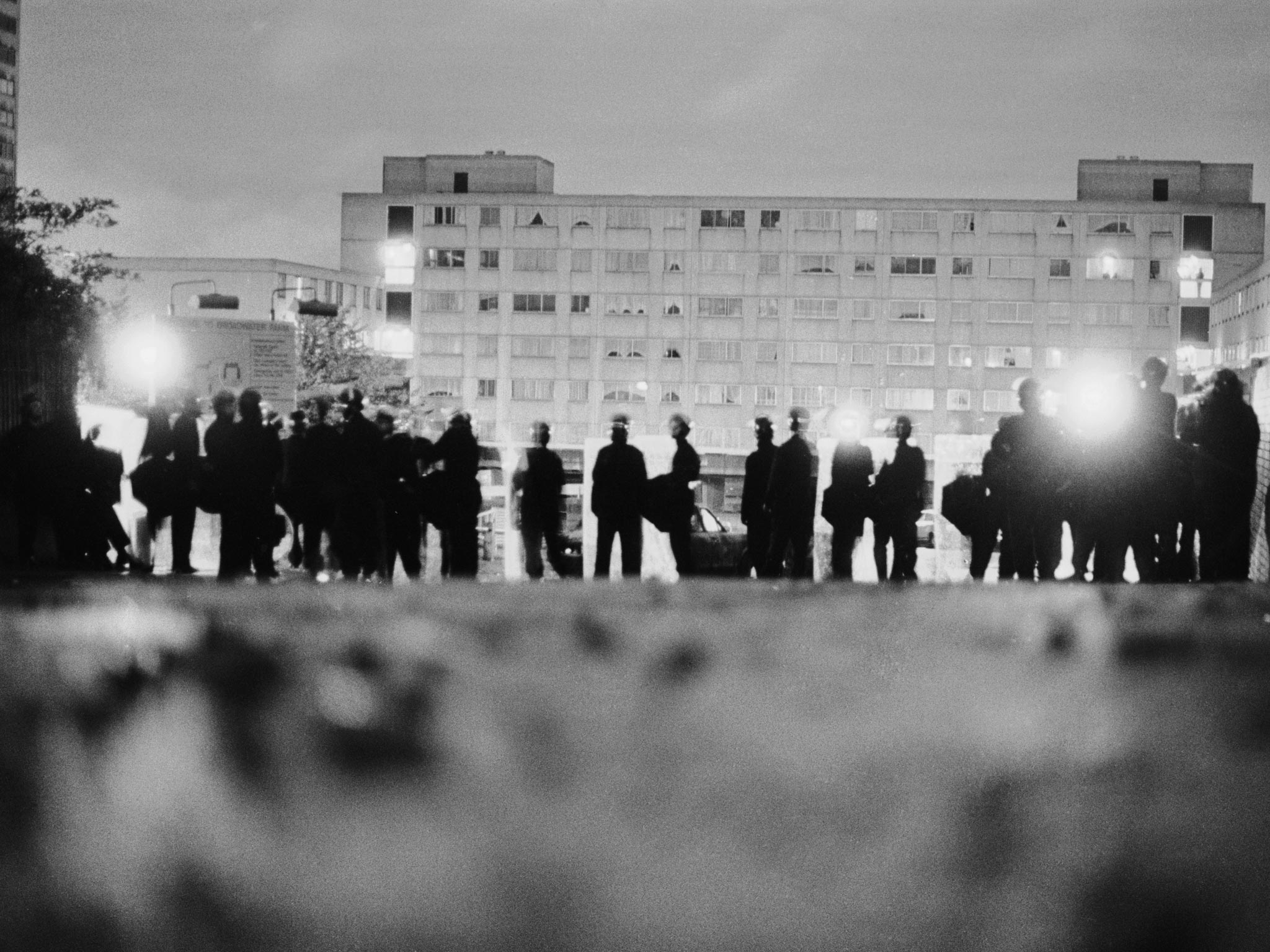 Police officers in riot gear on the Broadwater Farm housing estate, Tottenham, London, the morning after the riot of 6th October 1985