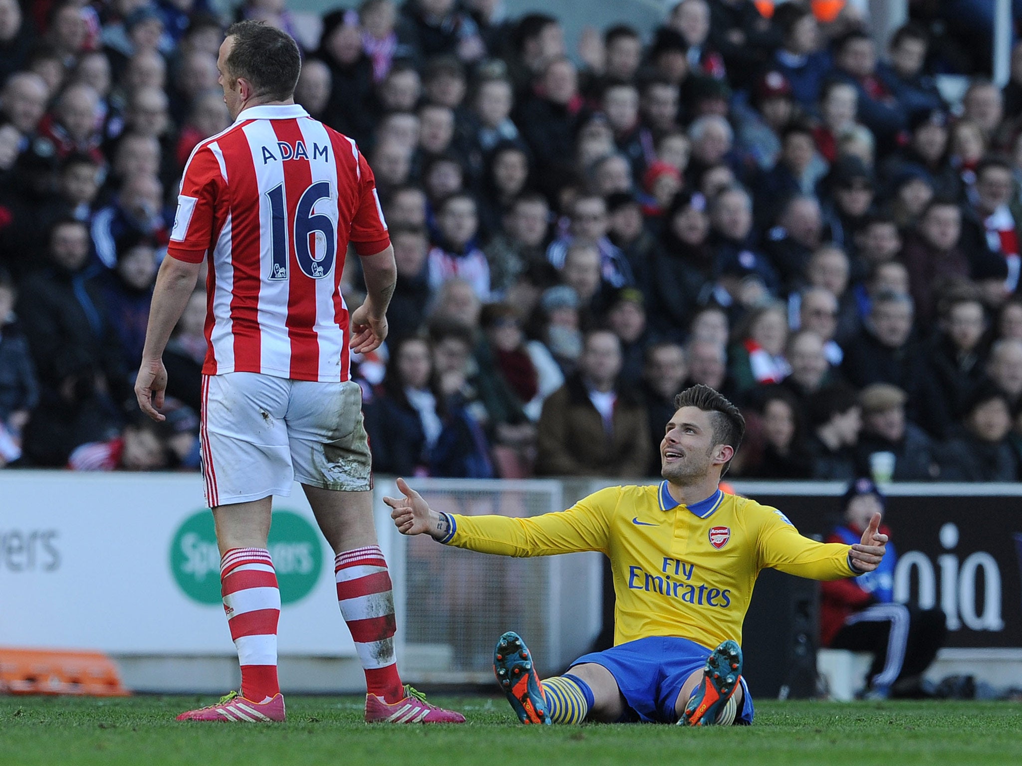 Olivier Giroud reacts after an altercation with Charlie Adam
