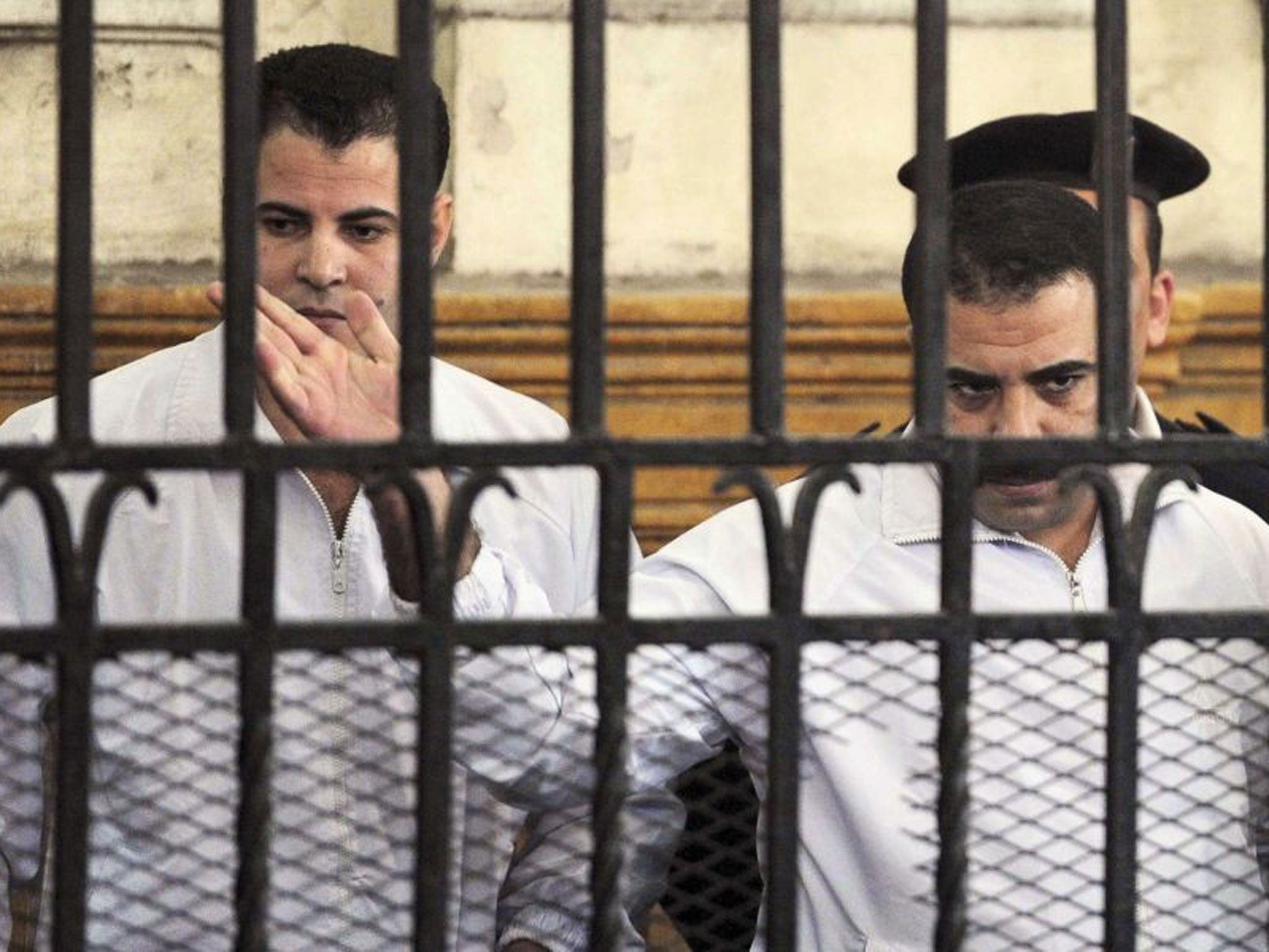 Egyptian policemen Awad Suleiman (right) and Mahmoud Salah were sentenced to 10 years in prison on Monday for torturing an activist to death in 2010