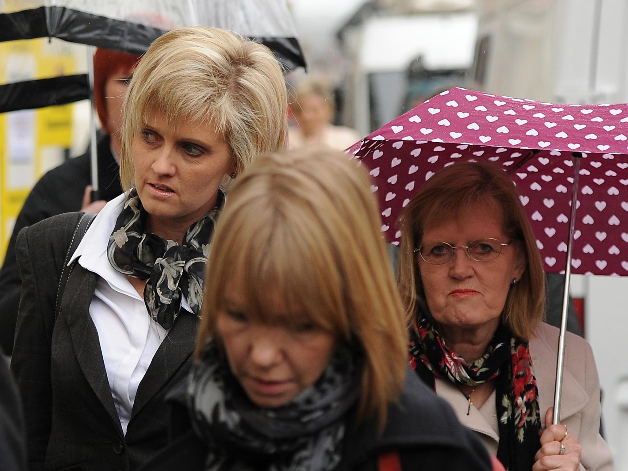 Khristina Swain (left), sister of Corporal Anne-Marie Ellement and her mother Alexandra Barritt (right) arrive at Wiltshire and Swindon Coroner's Court