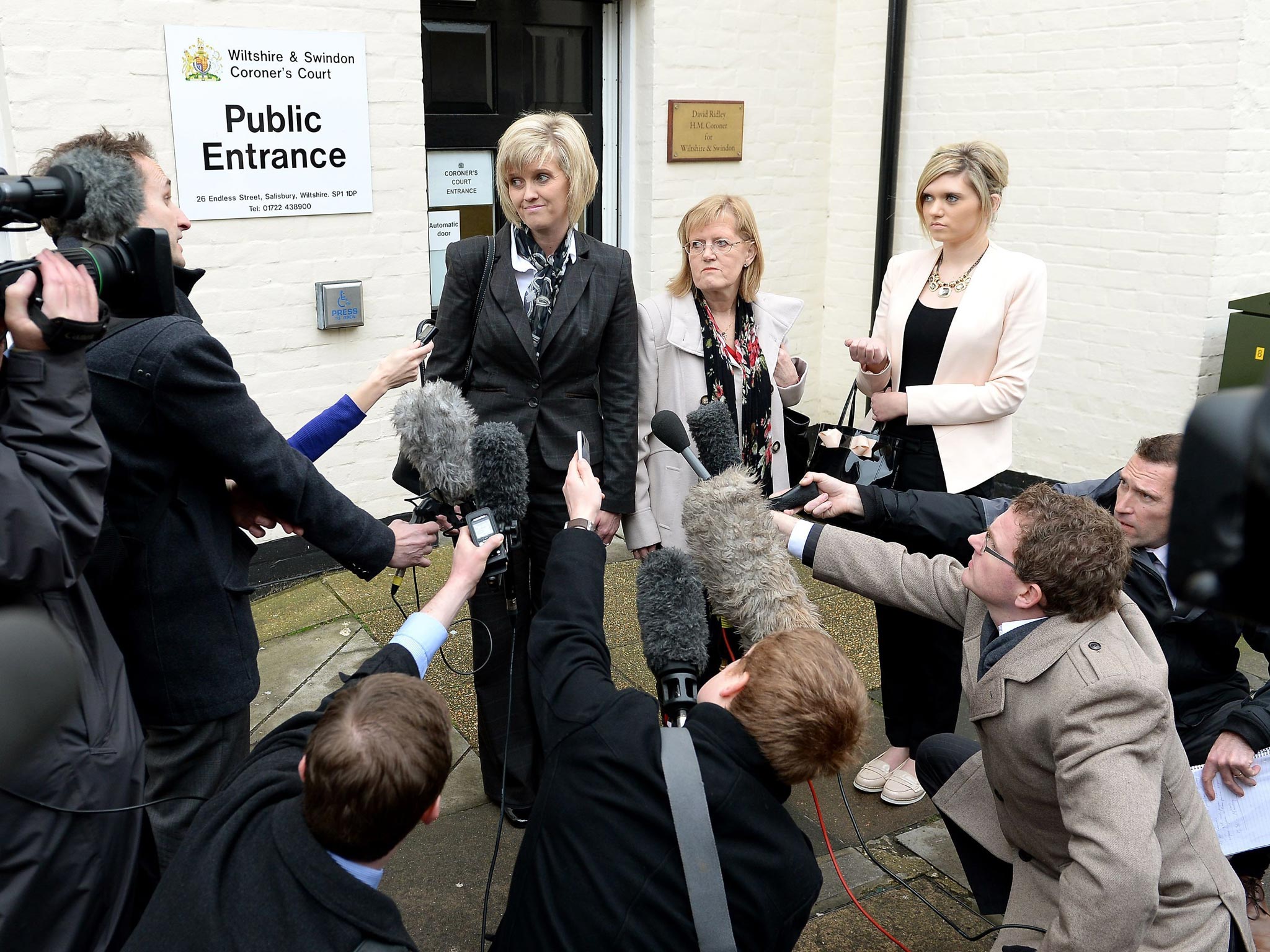 Khristina Swain (left), sister of Corporal Anne-Marie Ellement and her mother Alexandra Barritt (centre) issue a brief statement outside Wiltshire and Swindon Coroner's Court