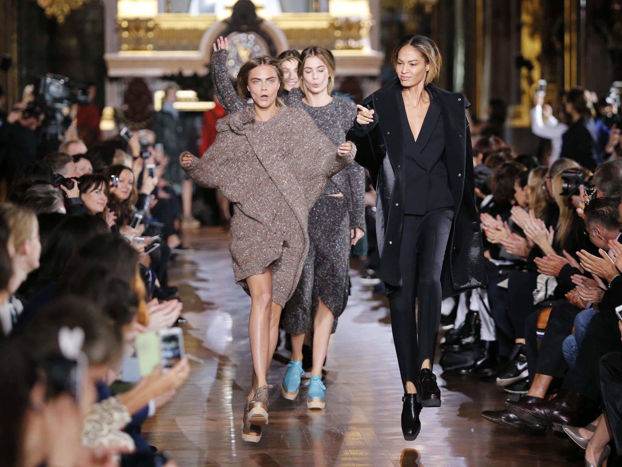 Models Cara Delevingne, left, and Joan Smalls on the runway during Stella McCartney’s ready-to-wear collection