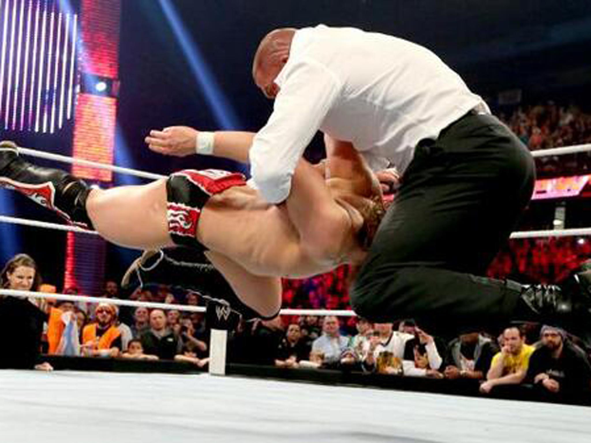 Triple H delivers a pedigree to Daniel Bryan on Raw in Chicago