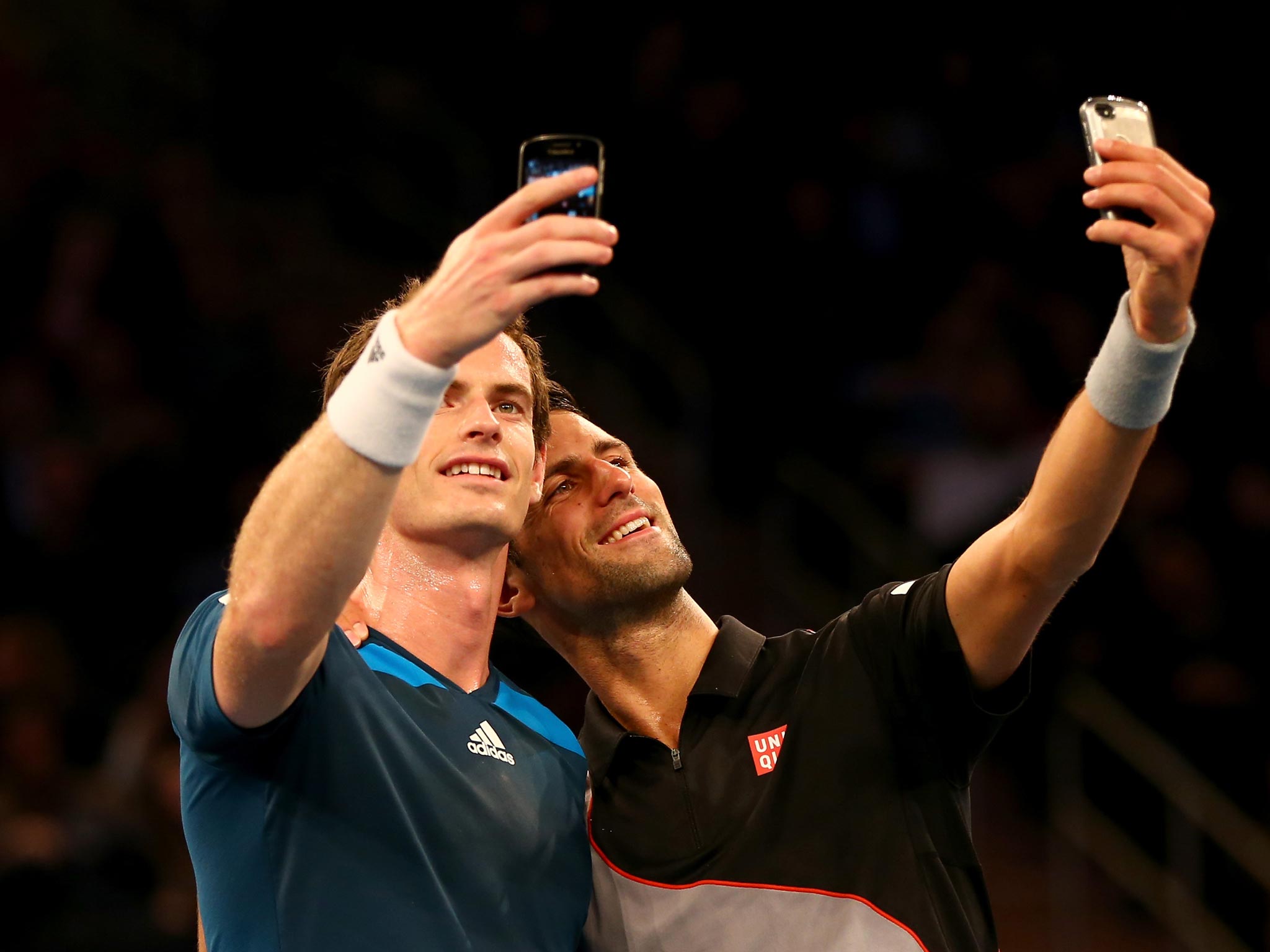 Andy Murray and Novak Djokovic stop during their exhibition match at Madison Square Garden to take a selfie