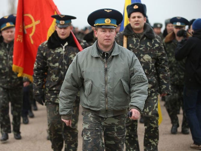 Colonel Yuli Mamchor, commander of the Ukrainian military garrison at the Belbek airbase, leads his unarmed troops in a bid to retake Belbek airfield