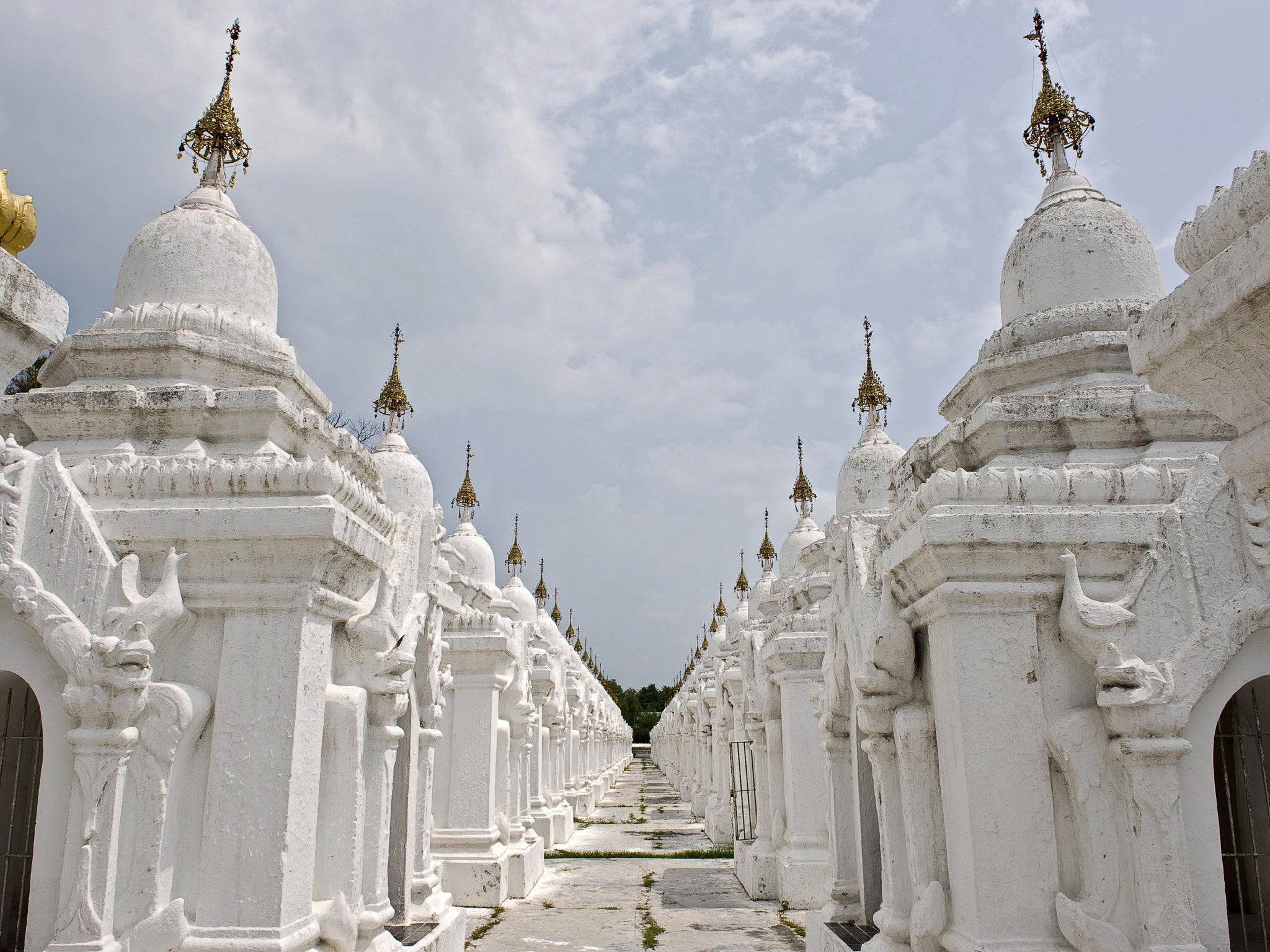 Some of the 729 stupas of the Kuthodaw pagoda in Mandalay. The pagoda contains the world's largest book, and lies at the foot of Mandalay Hill