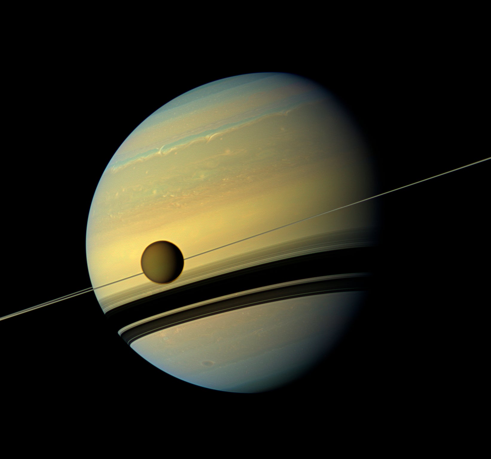 Titan is seen transitting in front of Saturn. At 3,200 miles across it's bigger than Mercury.