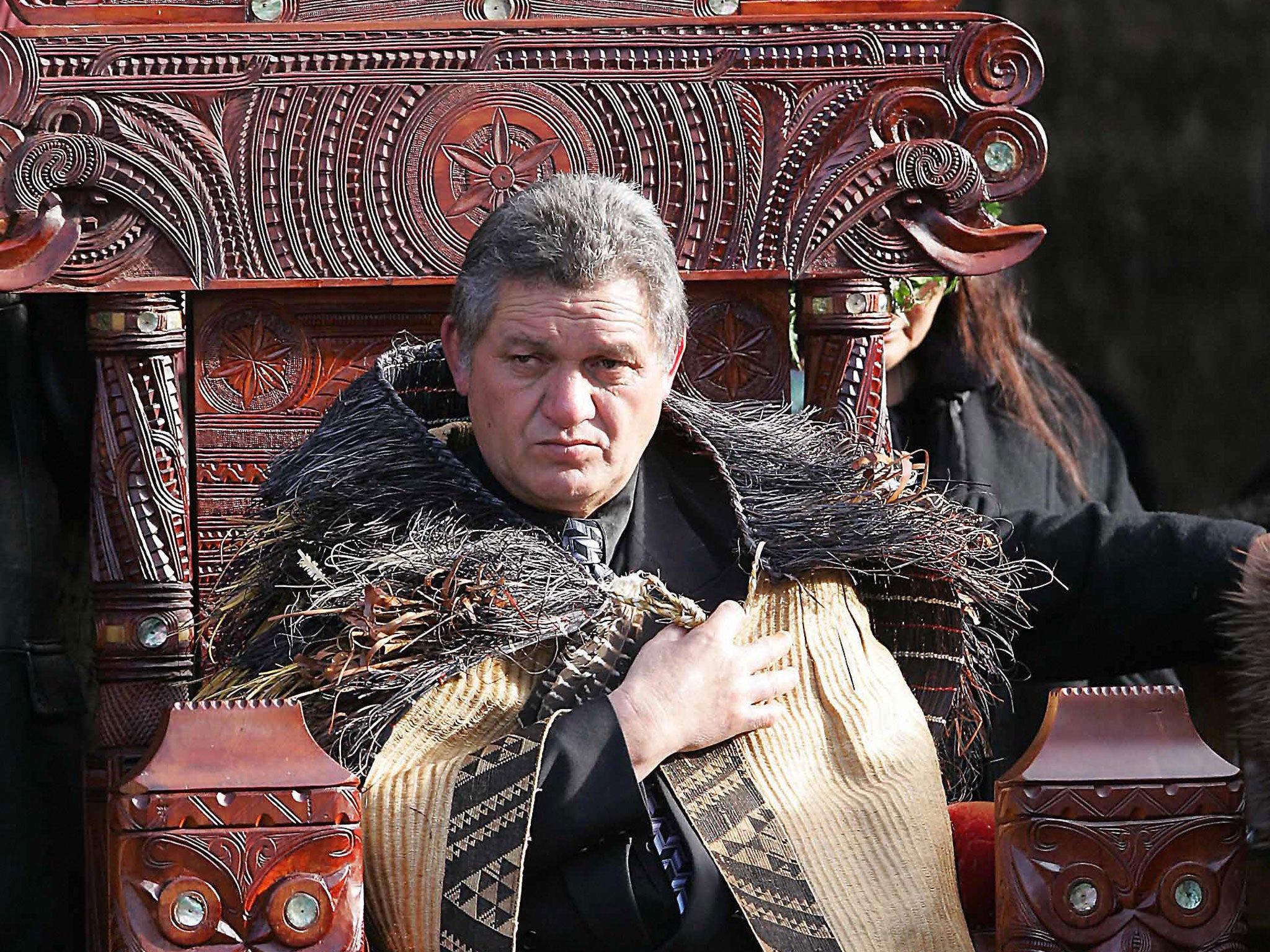 Maori King Tuheitia Paki sits on the carved wooden throne during his coronation ceremony in August 2006.
