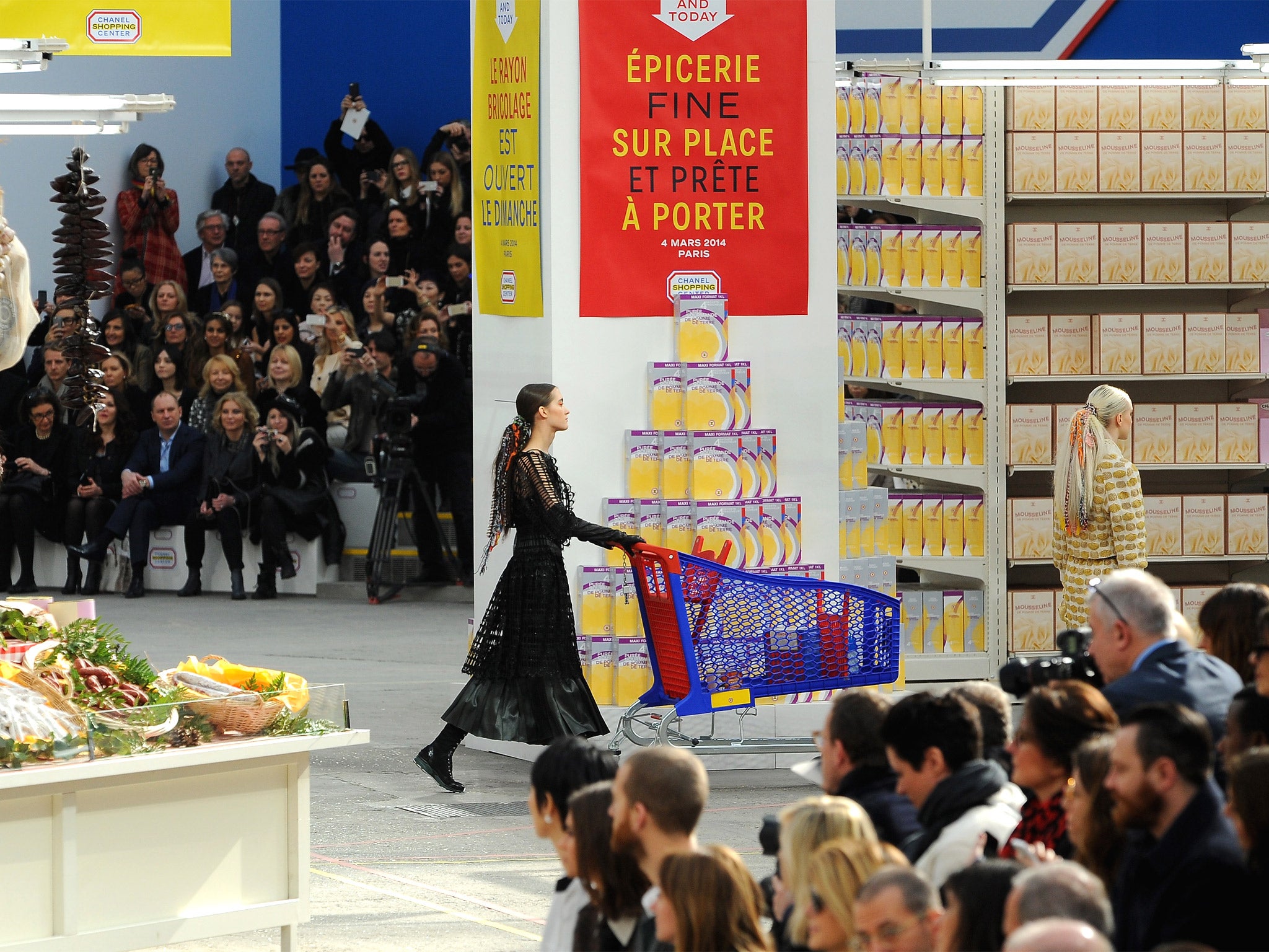 Models present creations by German designer Karl Lagerfeld as part of his Fall/Winter 2014-2015 women's ready-to-wear collection