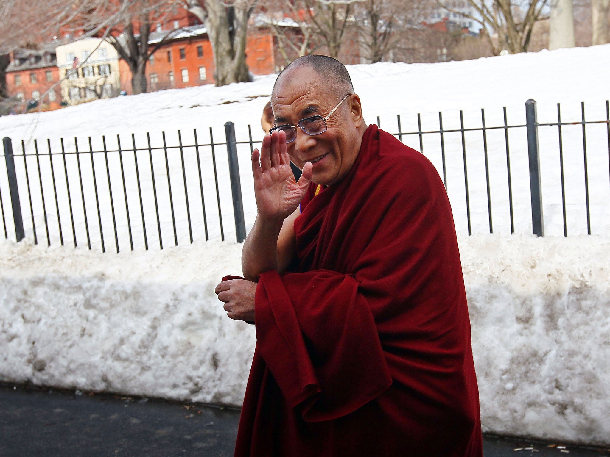 Chilled out: the Dalai Lama braves the cold again on a more recent visit to America