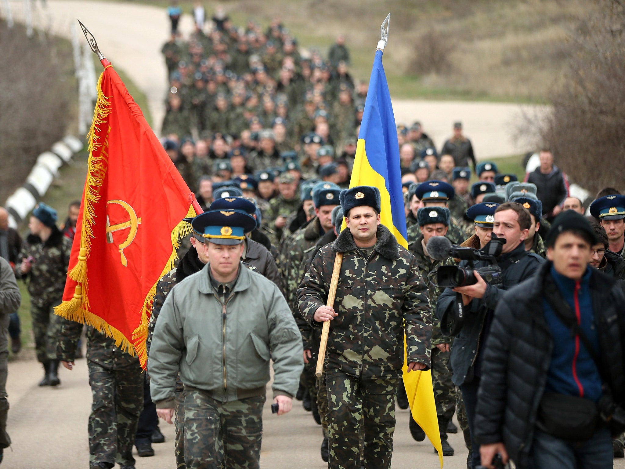 Colonel Yuli Mamchor, commander of the Ukrainian military garrison at the Belbek airbase, leads his unarmed troops to retake the Belbek airfield from soldiers under Russian command in Crimea