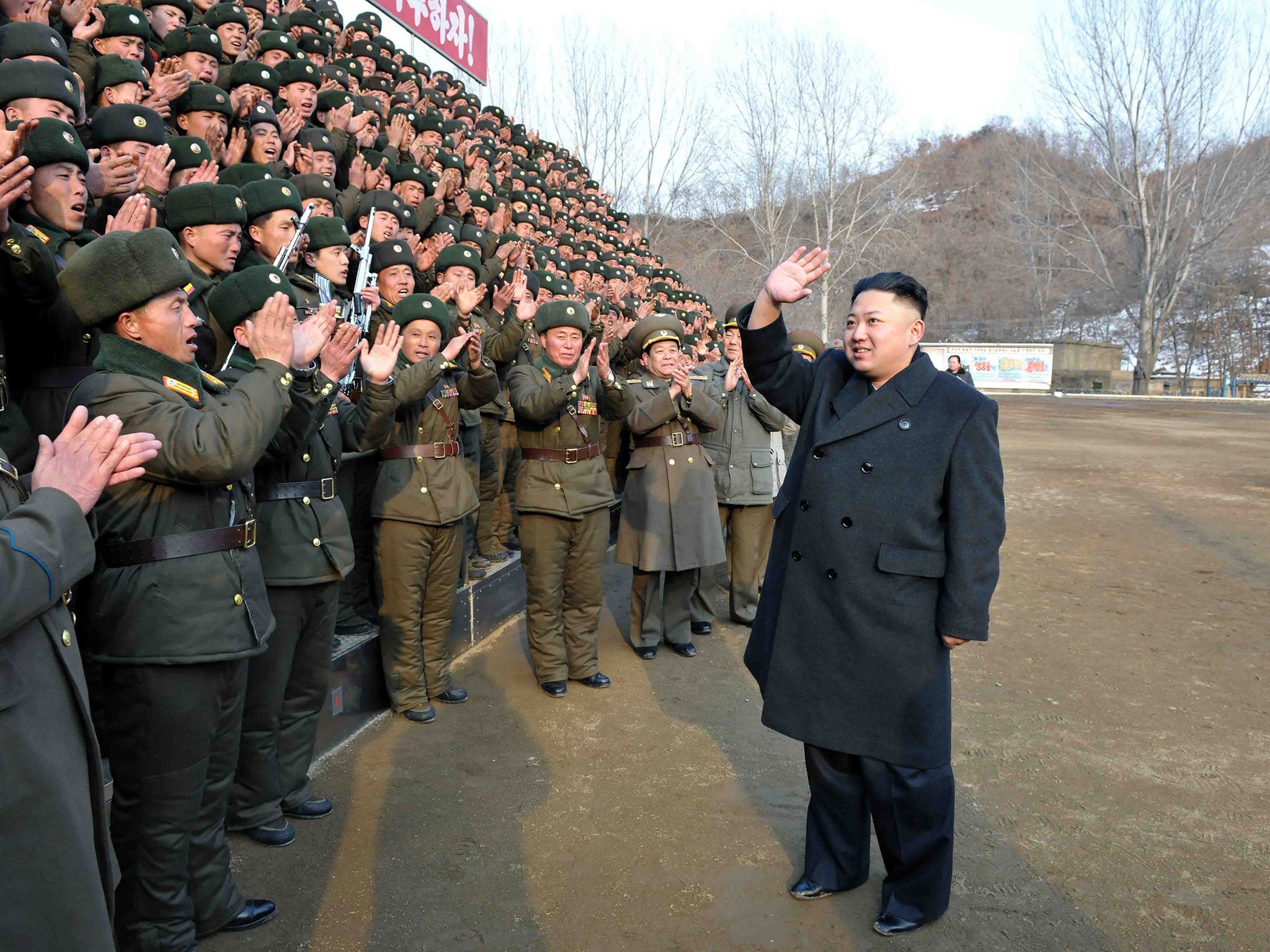 Kim Jong-un waves during an inspection of the Korean People's Army Unit 323 honoured with the title of O Jung-hup-led 7th Regiment in Pyongyang