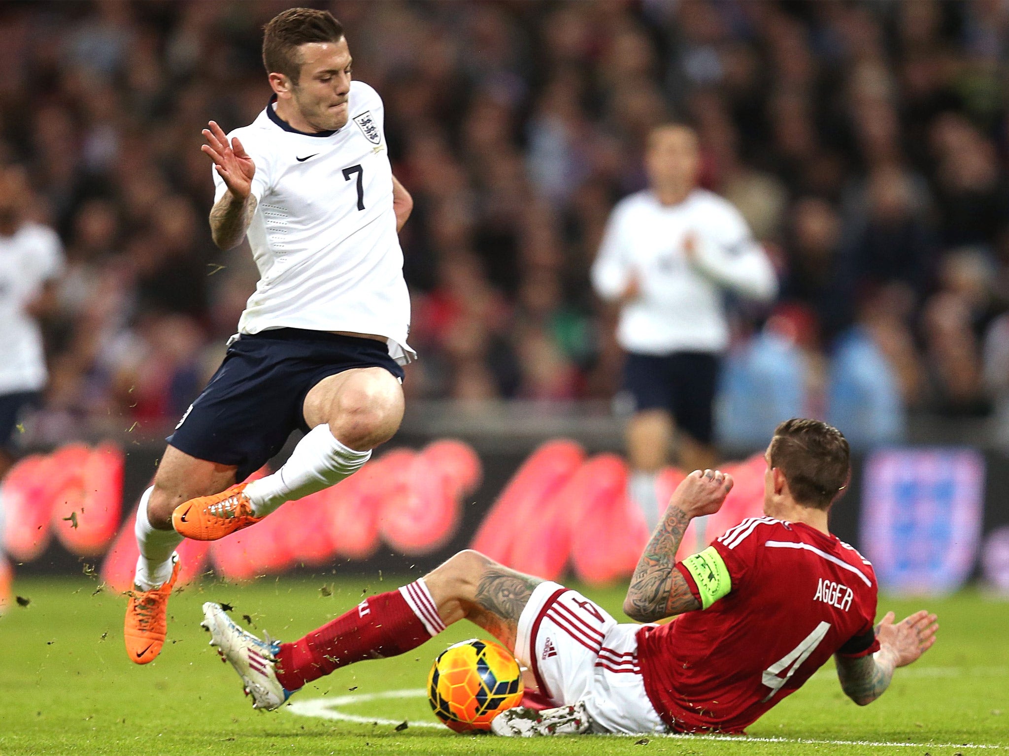 Jack Wilshere clashes with Denmark’s Daniel Agger