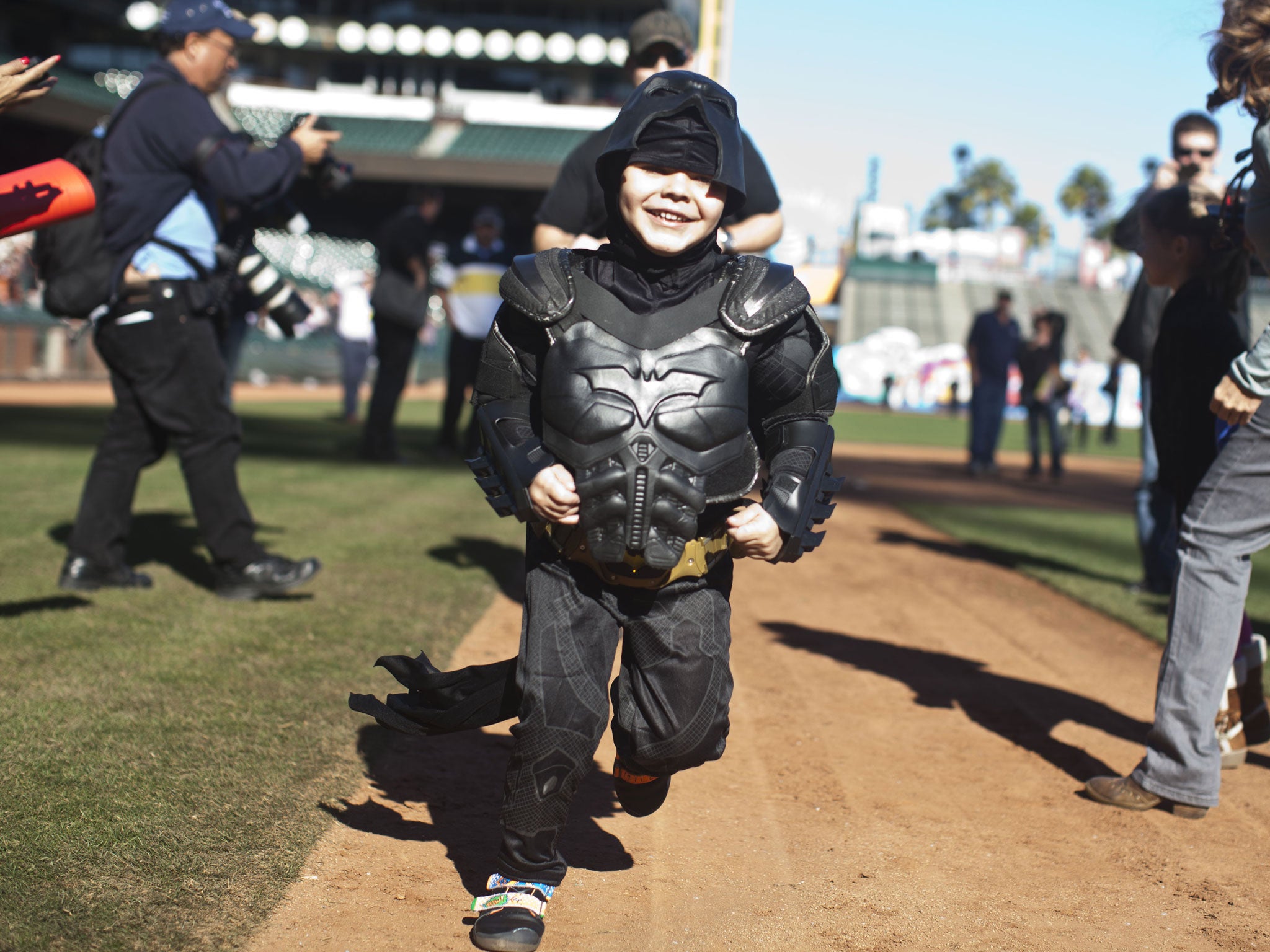 Leukemia survivor Miles Scott, 5, here seen running around San Francisco's baseball park as Batkid, was deprived the opportunity to star in the Oscars ceremony